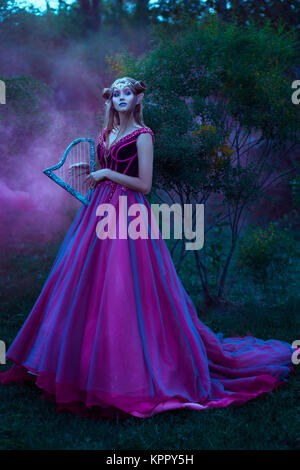 Elf woman in violet dress Stock Photo