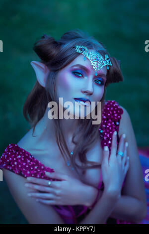 Elf woman in violet dress Stock Photo