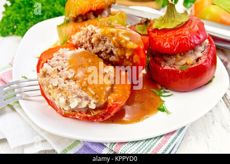 Pepper stuffed meat and rice with sauce in plate on table Stock Photo