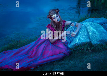 Elf woman in violet dress Stock Photo