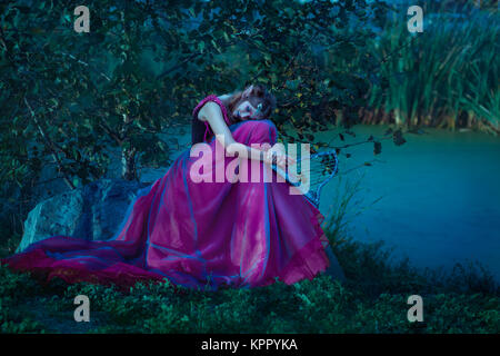 Elf woman in violet dress Stock Photo