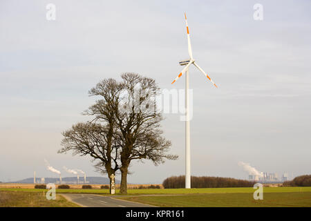 Europe, Germany, wind power plant near Bedburg, in the background the power stations Frimmersdorf and Neurath.  Europa, Deutschland, Windkraftanlage b Stock Photo