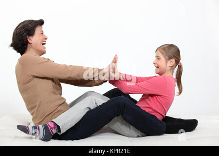 Mother playing with daughter Stock Photo