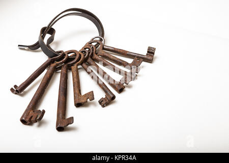 Nine keys on leather strap. isolated on white , with copy space Stock Photo
