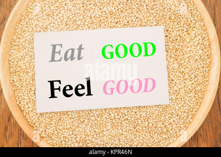 Eat good feel good quote on quinoa and business card Stock Photo