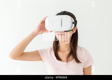 Woman using virtual reality device Stock Photo