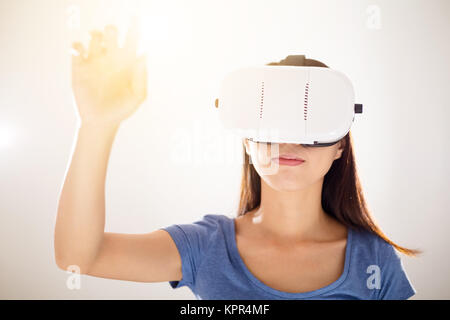 Asian Woman using VR device and hands touch up Stock Photo