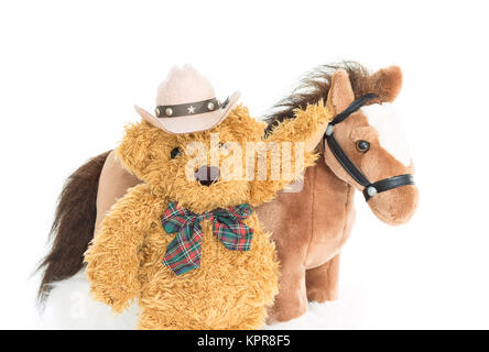 Cowboy Teddy bear and horses Stock Photo