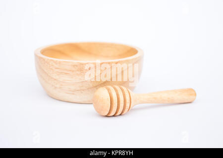 Wooden bowl and dipper on white background Stock Photo