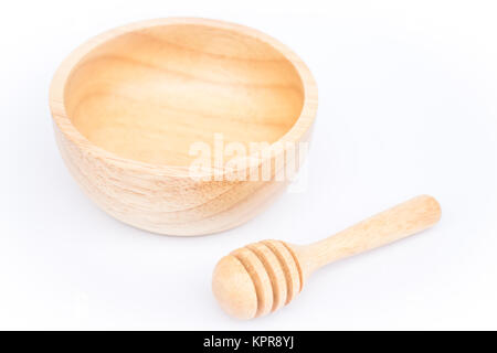 Wooden bowl and dipper on white background Stock Photo