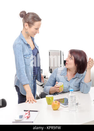 Attractive two female colleagues are making a break Stock Photo