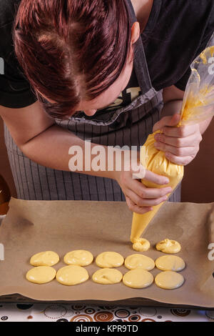 Piping tray of macaroons Stock Photo