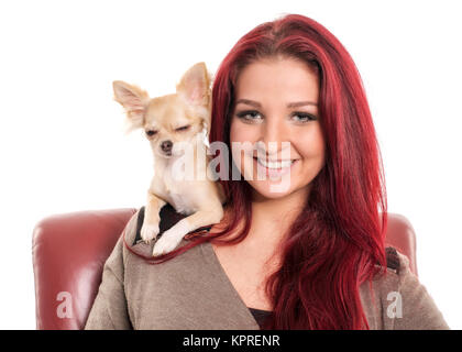 pretty red-haired woman with small pet dog Stock Photo