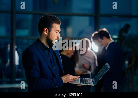 Business man or accountant working on laptop computer with business document Stock Photo