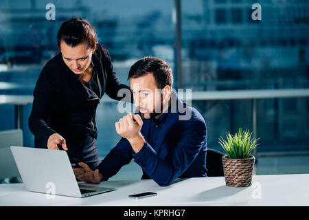 We already have great results. woman pointing at laptop Stock Photo