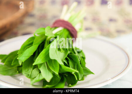 A bundle of ransom on a white dish in the kitchen. Stock Photo