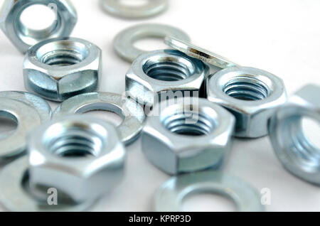 Several metal screw washers and nuts Stock Photo