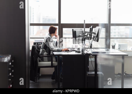 Business woman working in corporate office. Stock Photo