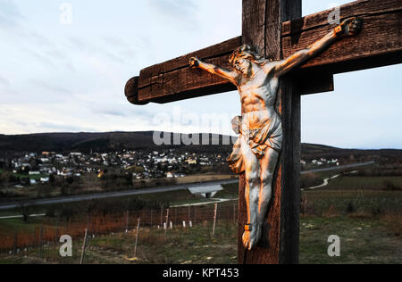 christ on the cross watches over a town