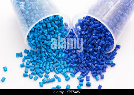 2 different dyed blue plastic granulates in lab Stock Photo