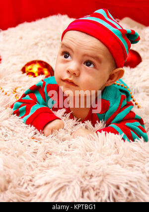 Baby dressed in a Christmas costume Stock Photo