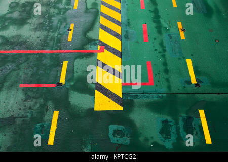 Green ferry deck with colorful marking, transportation background Stock Photo