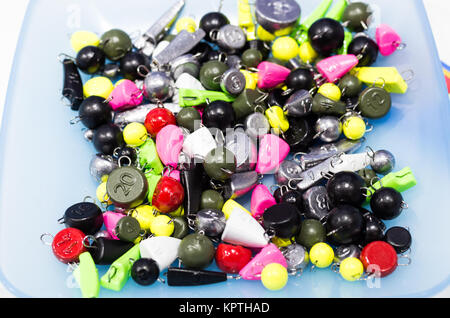 Multicolored fishing weights. Weights of baits for fishing. Stock Photo