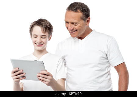 Father and son using digital tablet Stock Photo