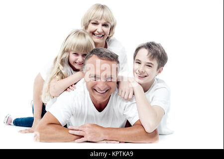 Sweet family having fun on the floor . Stock Photo