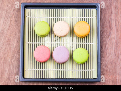 Colorful macarons on a bamboo mat Stock Photo