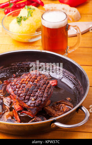roasted pork dish in a pan Stock Photo