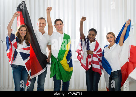 Friends With Flags From Different Nations Stock Photo