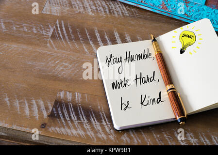 Handwritten text Stay humble, work hard, be kind Stock Photo