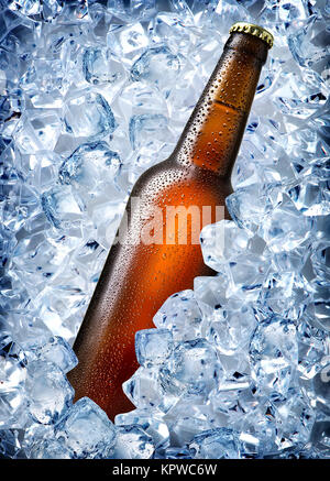 Brown bottle in ice Stock Photo