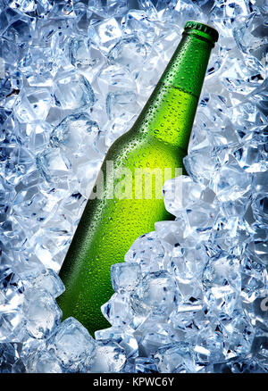 Green bottle in ice Stock Photo