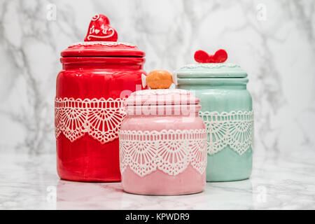 Colorful Ceramic Round Jars with Lace Patterns Stock Photo