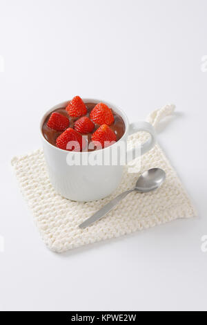 strawberries in chocolate pudding Stock Photo