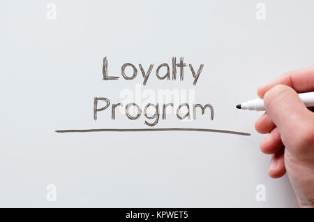 Loyalty program written on whiteboard Stock Photo