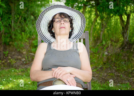 beautiful woman relaxing in the garden Stock Photo