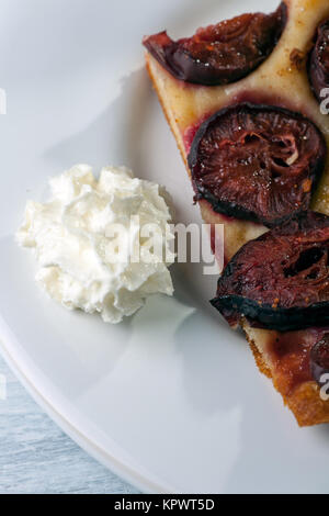 cream and plum cake Stock Photo