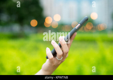 Woman hold with cellphone Stock Photo