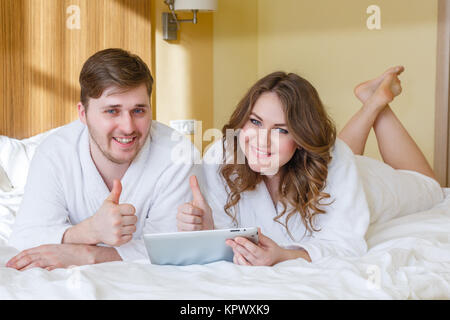 Happy couple with computer tablet. Stock Photo