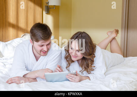 Happy couple with computer tablet. Stock Photo