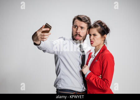 Two colleagues friends taking selfie with telephone camera Stock Photo