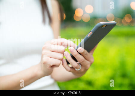 Girl use of mobile phone Stock Photo