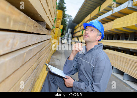 man taking a note in the warehouse Stock Photo