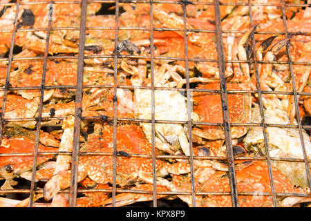 Grilled crab on flaming grill. Stock Photo