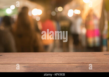 Wooden table of brown on front blurred night street background. presentation product Stock Photo