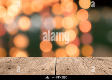 Blank wooden table of brown on front blurred bokeh background, mock up for presentation Stock Photo