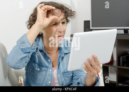 a middle-aged woman with eyes pain Stock Photo